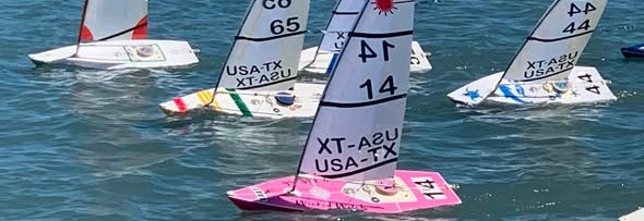 RC Laser fleet racing on the water